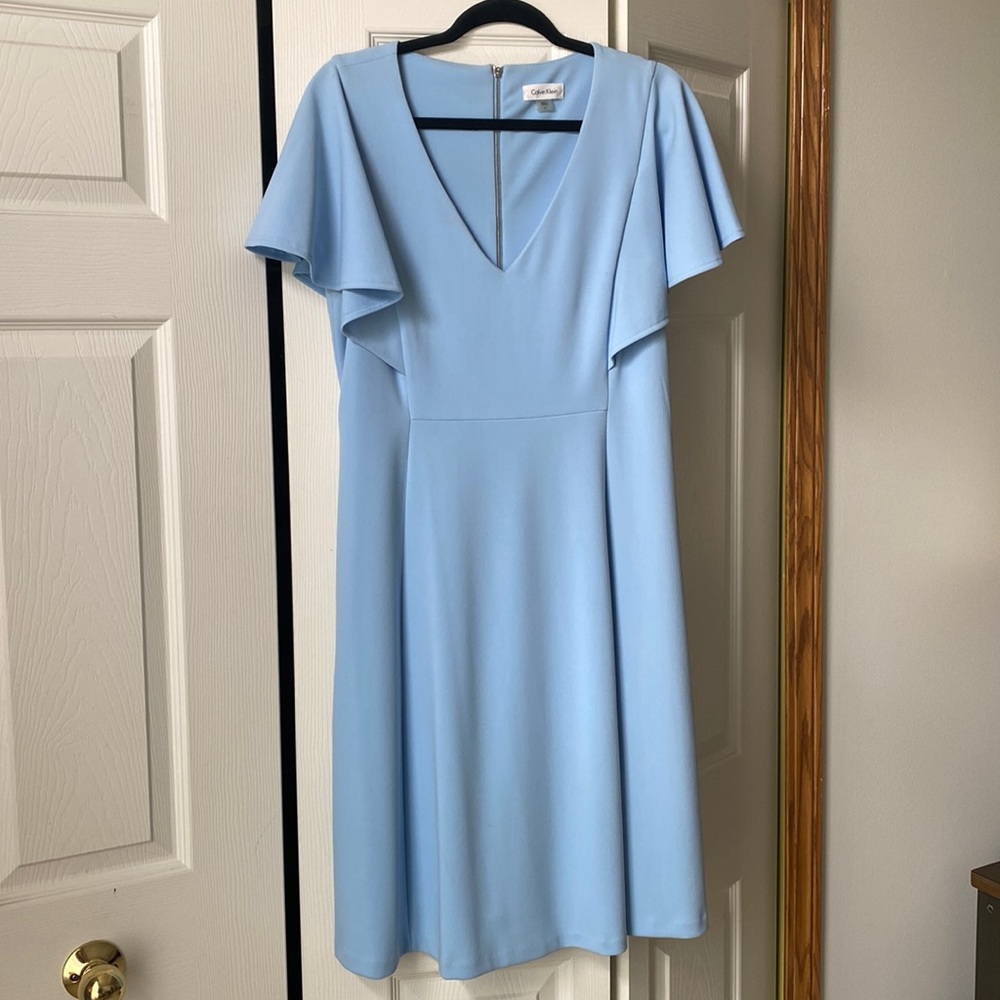 Beautiful summer blue butterfly sleeve Calvin Klein dress. Hem hits at the knee